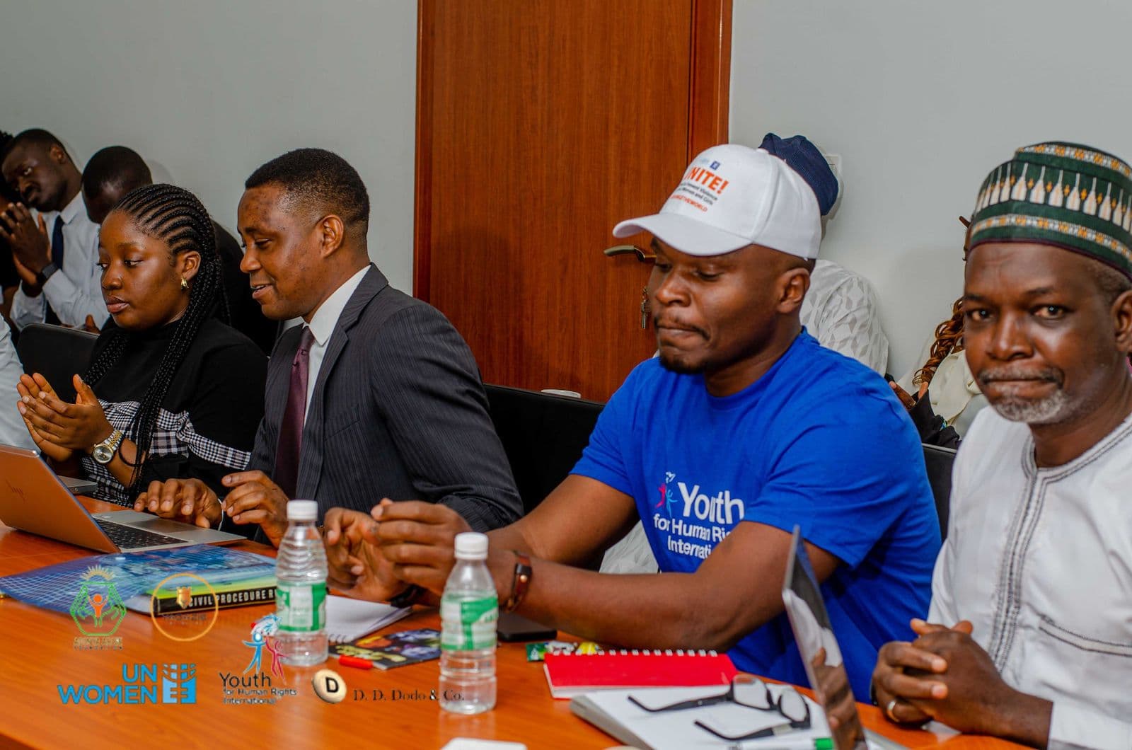 A facilitator and participants at the workshop table