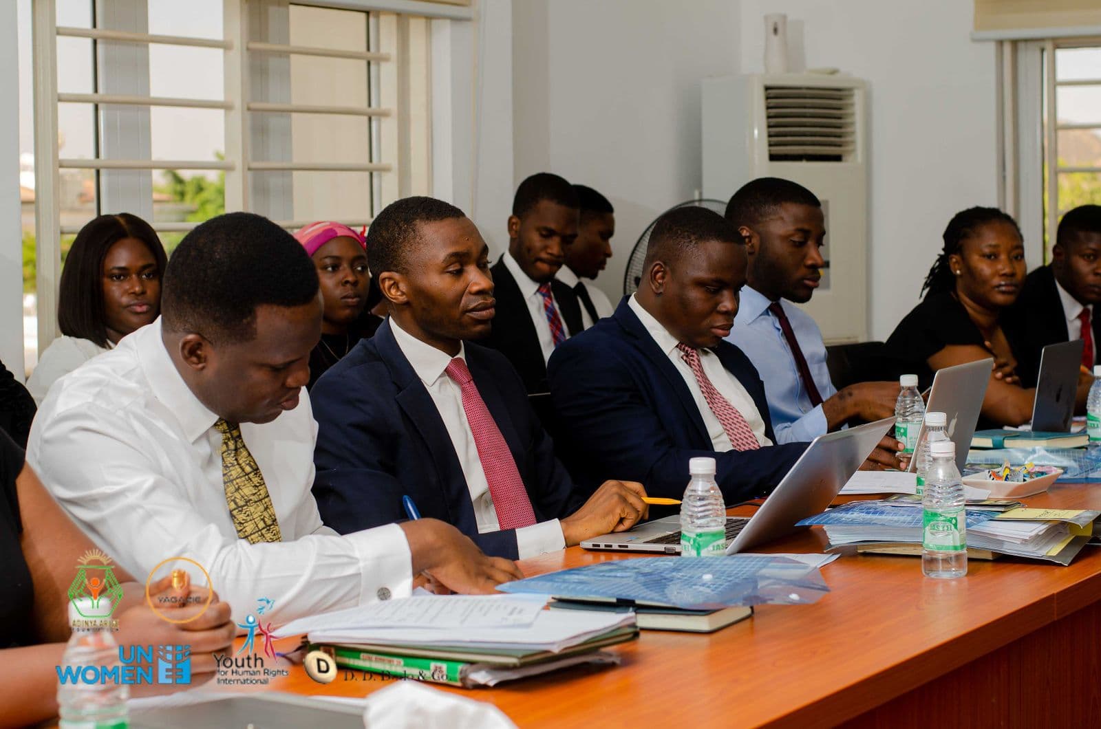 Professionals take notes at the workshop table