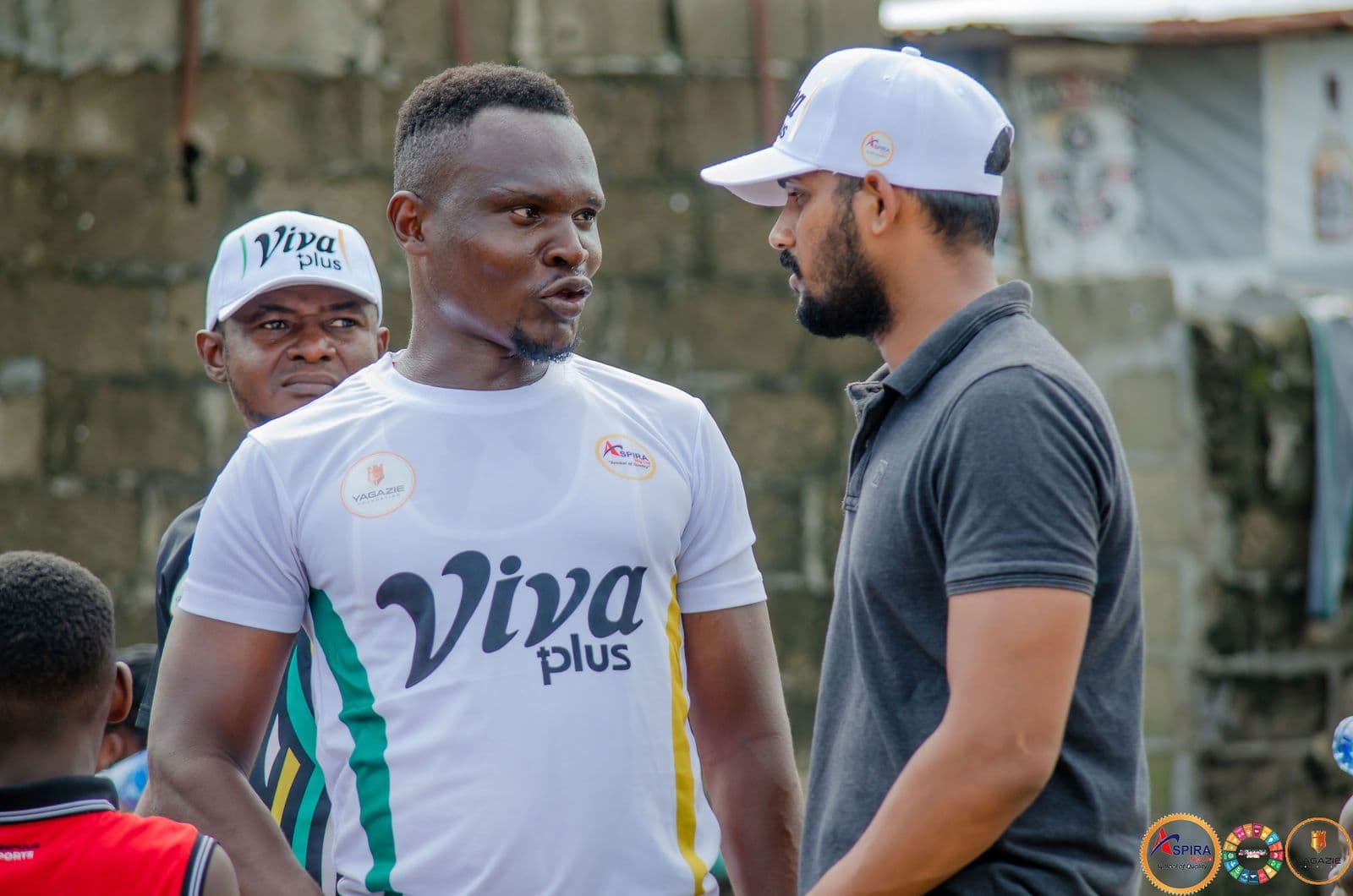 Two volunteers talk during the food distribution