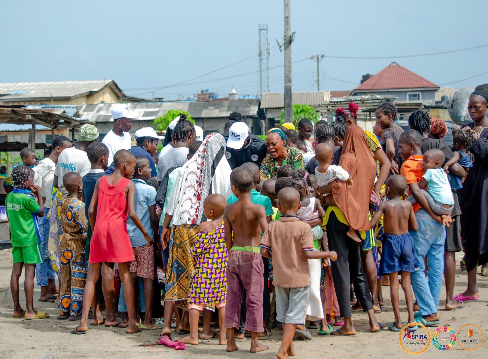 Families gather in Ajegunle for the food distribution